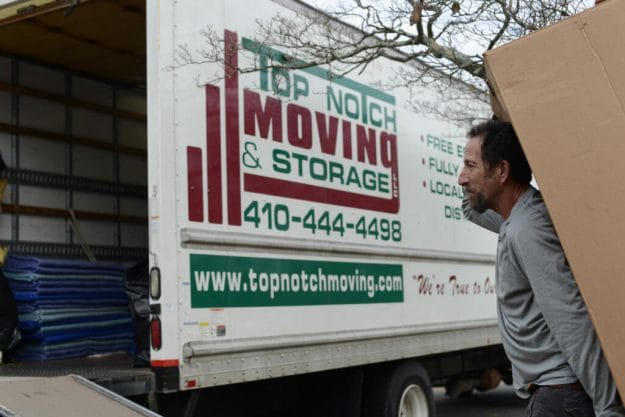 Top Notch moving company loading a moving truck close up