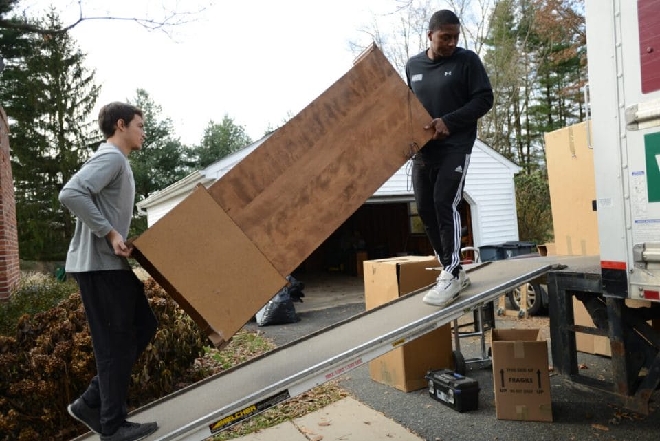 Loading a dresser into the moving truck
